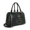 The Cross And Stud Accented Petite Satchel Handbag is a black faux leather bag with double handles, a top handle, detachable shoulder strap, silver stud accents in curved patterns, and a decorative silver cross chain.