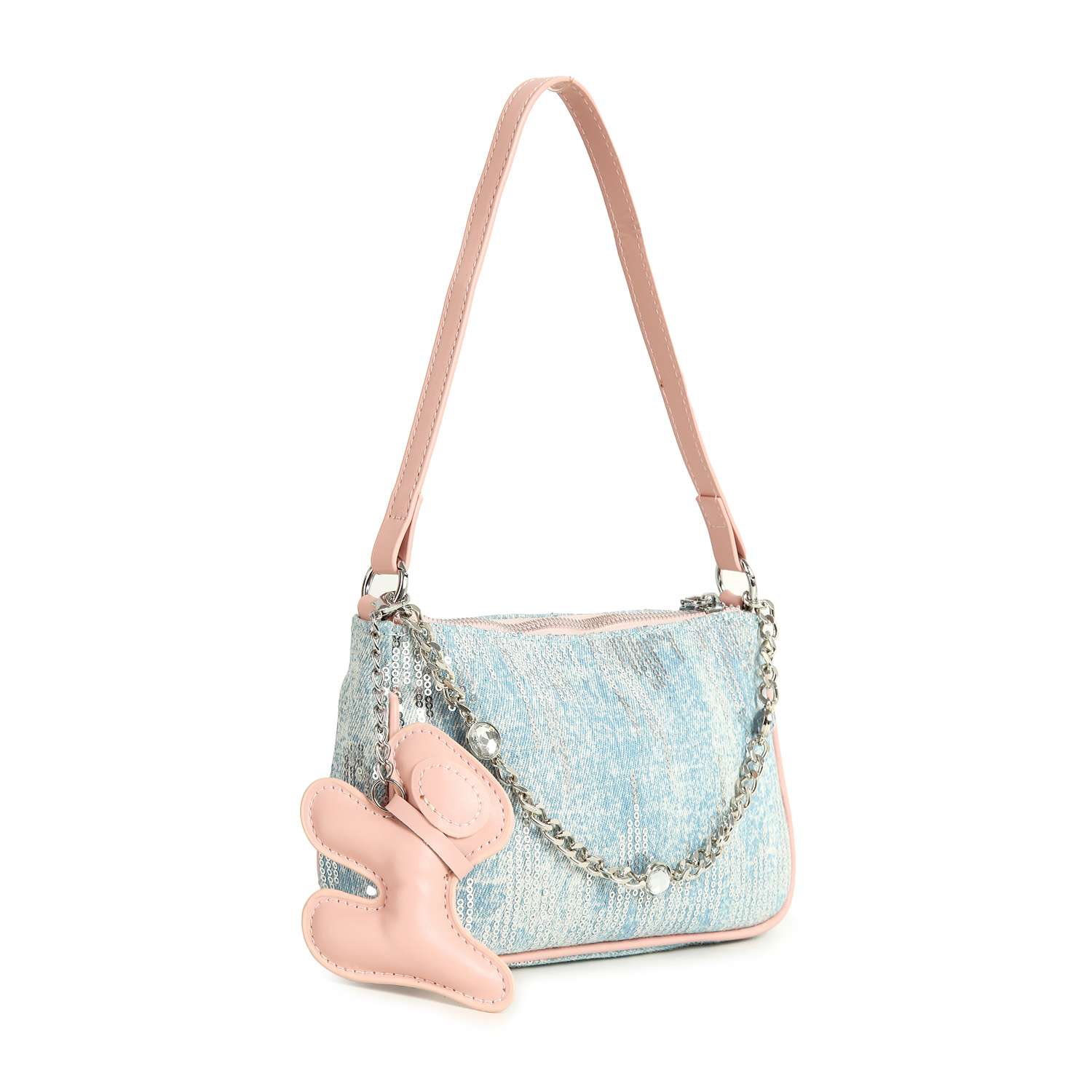 The Denim And Sequin Decorative Hobo is a small blue textured denim sling bag with light pink faux leather trim, silver chain accents, and a plush pink bunny-shaped charm hanging from the single strap.