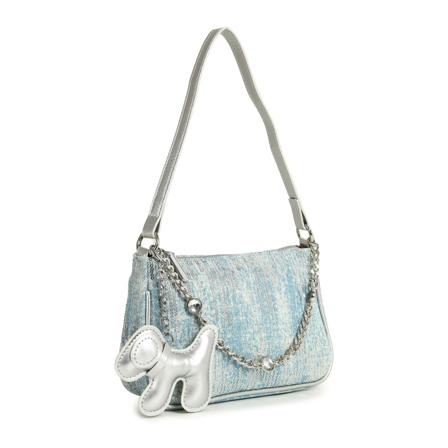 The Denim And Sequin Decorative Hobo is a light blue textured denim sling bag with faux leather trim, a single silver shoulder strap, a decorative silver chain, and a metallic silver dog-shaped charm on the front.