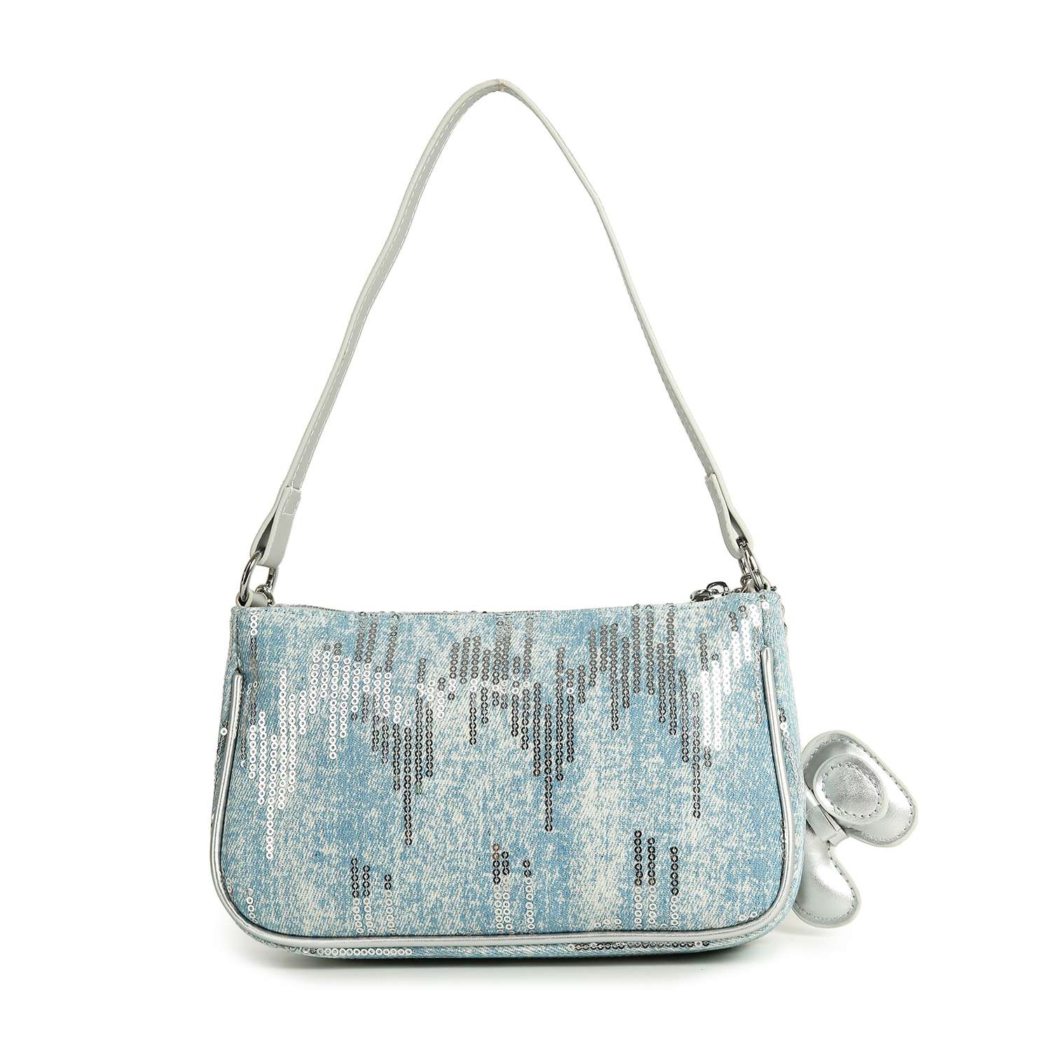 The Denim And Sequin Decorative Hobo is a light blue single-strap shoulder bag with white faux leather trim, silver sequins, a small silver bow charm, and rounded rectangular edges for a chic look.