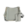 The Studded Slim Crossbody Bag is a light gray faux leather shoulder bag with gold studs and hardware. It features a wide adjustable strap, detachable matching pouch, clean lines, and chic metallic accents in a minimalist design.
