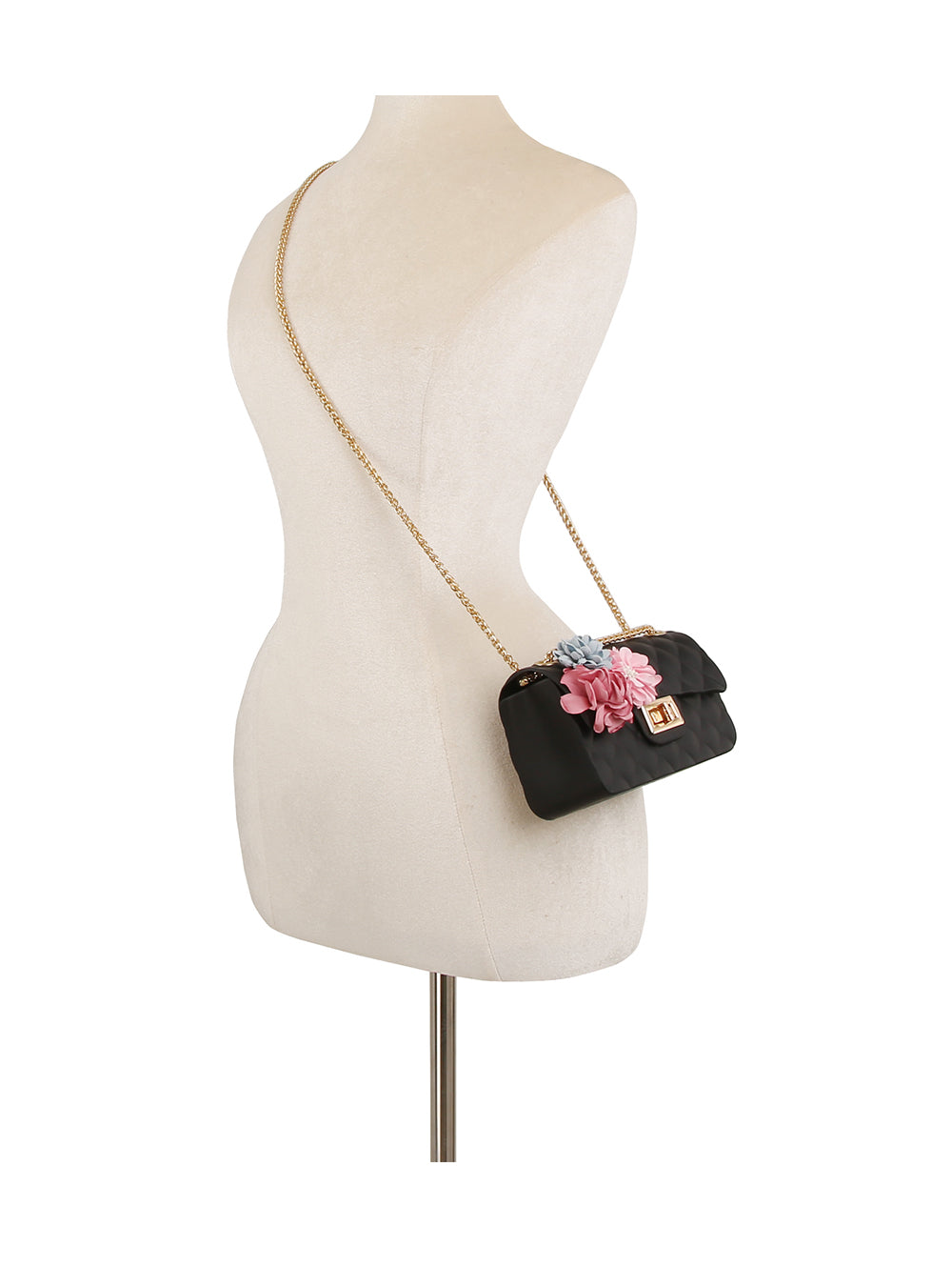The Floral Accented Petite Jelly Shoulder Bag, featuring a single strap, gold-toned hardware, and pink floral accents, is displayed on a dress form mannequin against a white background.
