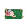 The Floral Accented Petite Jelly Shoulder Bag is a small green quilted handbag with a gold-toned chain strap, twist lock closure, and pink, light blue, and cream decorative fabric flowers on the front.