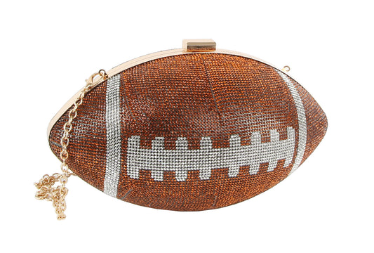 The *FINAL SALE ITEM* Rhinestone Bling Football Bag is a small handbag shaped like an American football, featuring brown, white, and black rhinestones with a gold chain strap—perfect for a sporty, sparkling touch.