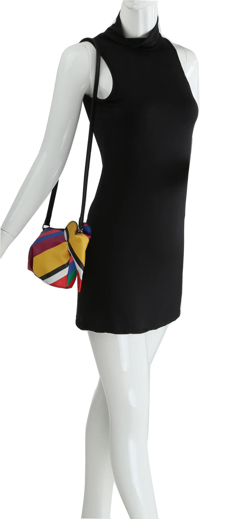 A mannequin in a sleeveless black mini dress carries the Unique Elephant Design Shoulder Bag, a small faux leather crossbody with a multicolored geometric pattern and adjustable strap draped over its shoulder.