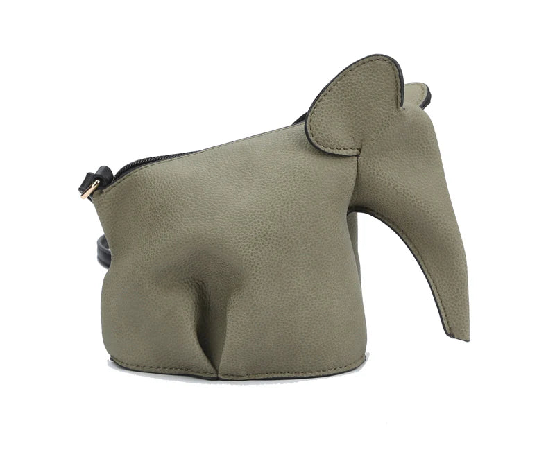 The Unique Elephant Design Shoulder Bag is crafted from textured olive-green faux leather, shaped like an elephant with a long trunk, rounded body, large floppy ear, and a top zip closure.