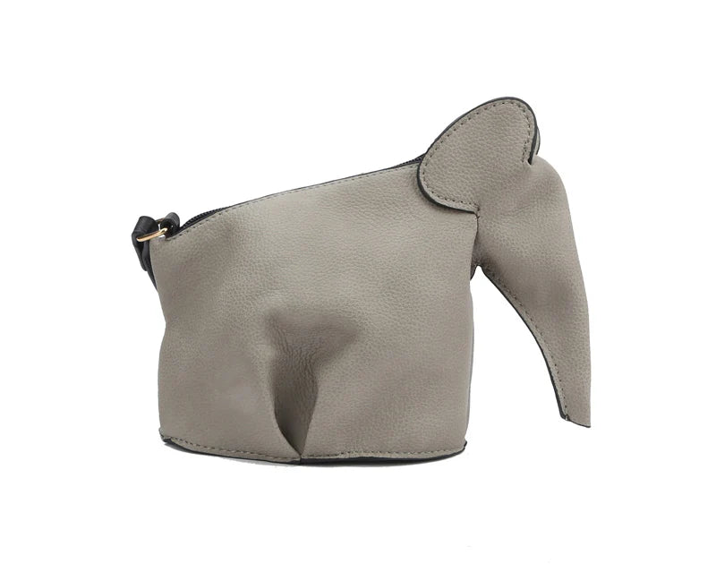 The Unique Elephant Design Shoulder Bag is a gray faux leather handbag shaped like an elephant, with ear, trunk, and body contours, plus a secure top zip closure.