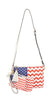 The American Flag 3 Piece Crossbody Set features a crossbody bag and matching faux leather wristlet with blue and white stars, red and white chevron stripes, tassel accents, and adjustable straps.