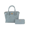 The Classic Tote Two Piece Set features a light blue faux leather bag with dual handles and gold-toned hardware, plus a matching zippered wallet. Tablet compatible, its perfect for everyday convenience.