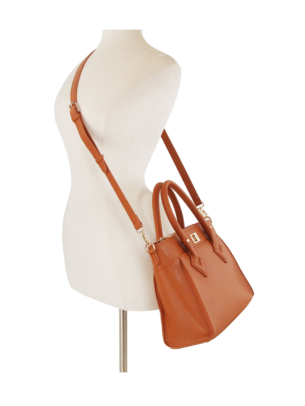 The Classic Tote Two Piece Set in tan faux leather with gold-toned hardware is displayed on a white mannequin. It features top handles, an adjustable crossbody strap, and is tablet compatible.