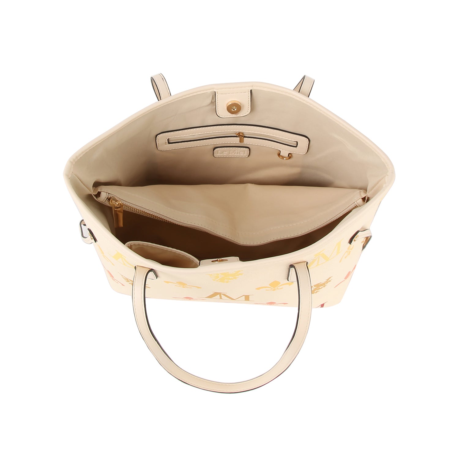 The Monogram Print Lux Faux Leather 2-Piece Tote Set is cream-colored with a beige interior, multiple compartments (zip pocket, slip pocket), and a clasp button closure, shown from above with the bag open.