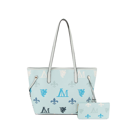 The Monogram Print Lux Faux Leather 2-Piece Tote Set features a light blue tote with a single strap, top zip closure, and blue, white, and navy crest motifs, paired with a matching light blue wallet displayed in front.