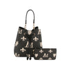 The 2 in 1 Monogram Print Faux Leather Bucket Bag features a black design with cream fleur-de-lis, lion, and M motifs, plus gold-tone accents. It comes with a matching wallet, has a tablet-friendly interior, and a drawstring closure.