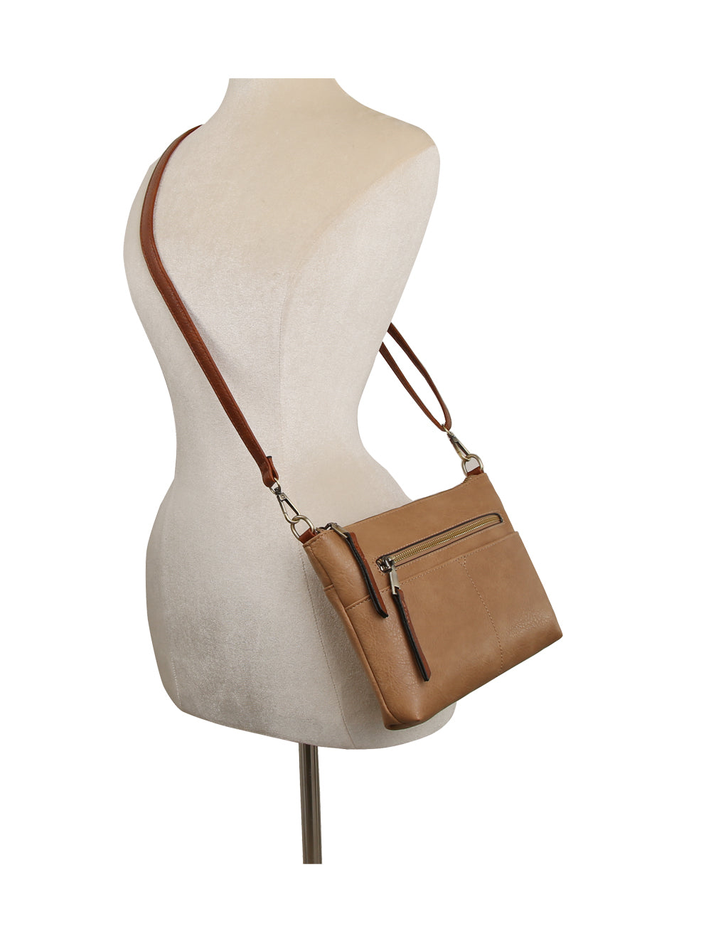The Front Pocket Slim Crossbody Bag in tan faux leather, featuring a front zip pocket and adjustable strap, is displayed on a mannequin torso against a white background.