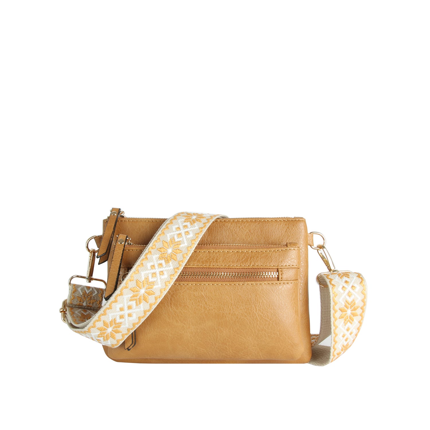 The Guitar Strap Crossbody Sling Handbag is a tan faux leather bag with dual zip pockets and a wide decorative fabric strap in a yellow and white geometric pattern, shown on a plain white background.