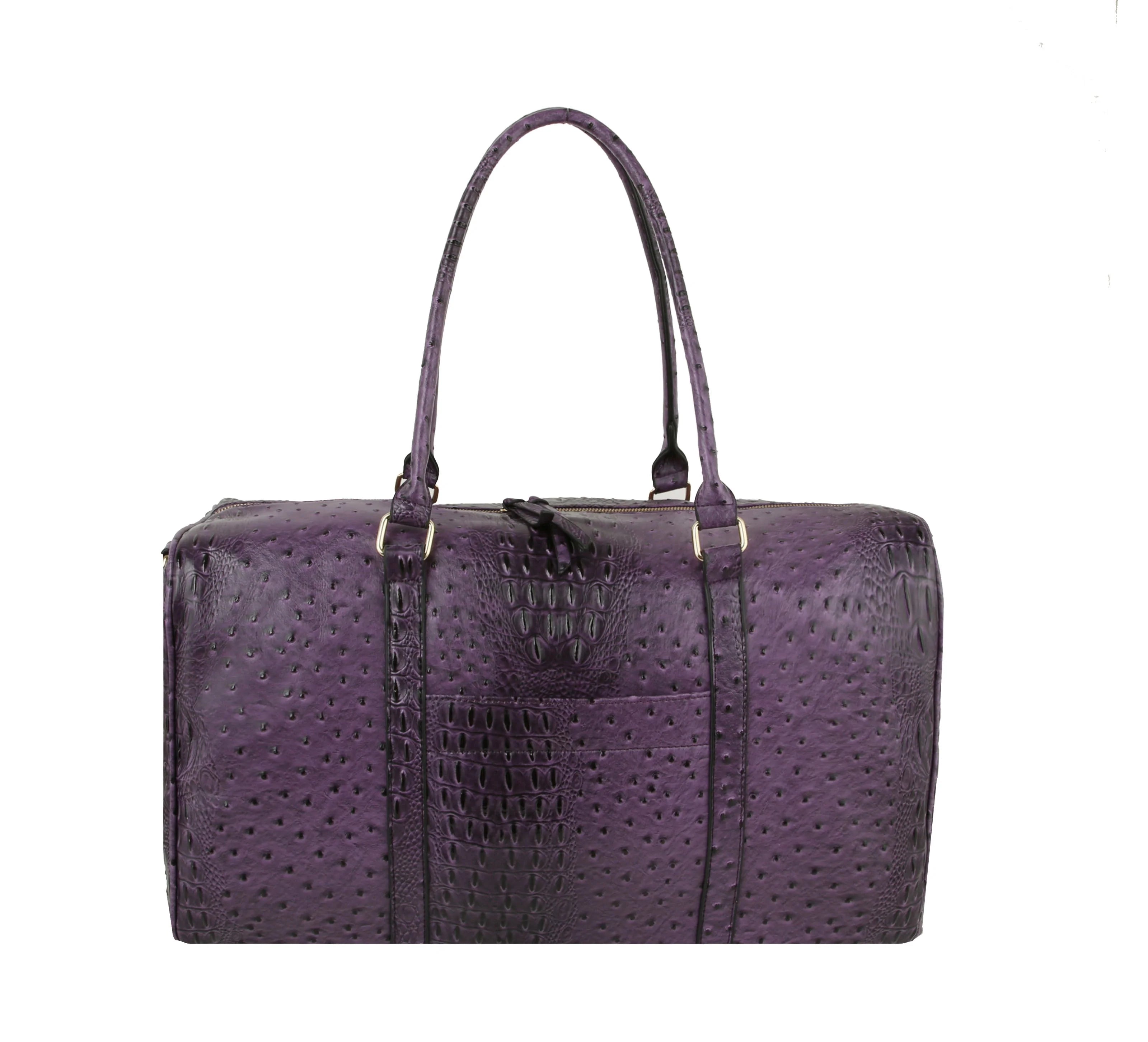 The Classic Embossed Carry-On Satchel is a purple, textured faux leather bag with two handles, a rectangular shape, crocodile or ostrich skin pattern, and a front pocket—ideal as a stylish travel tote, shown on a white background.