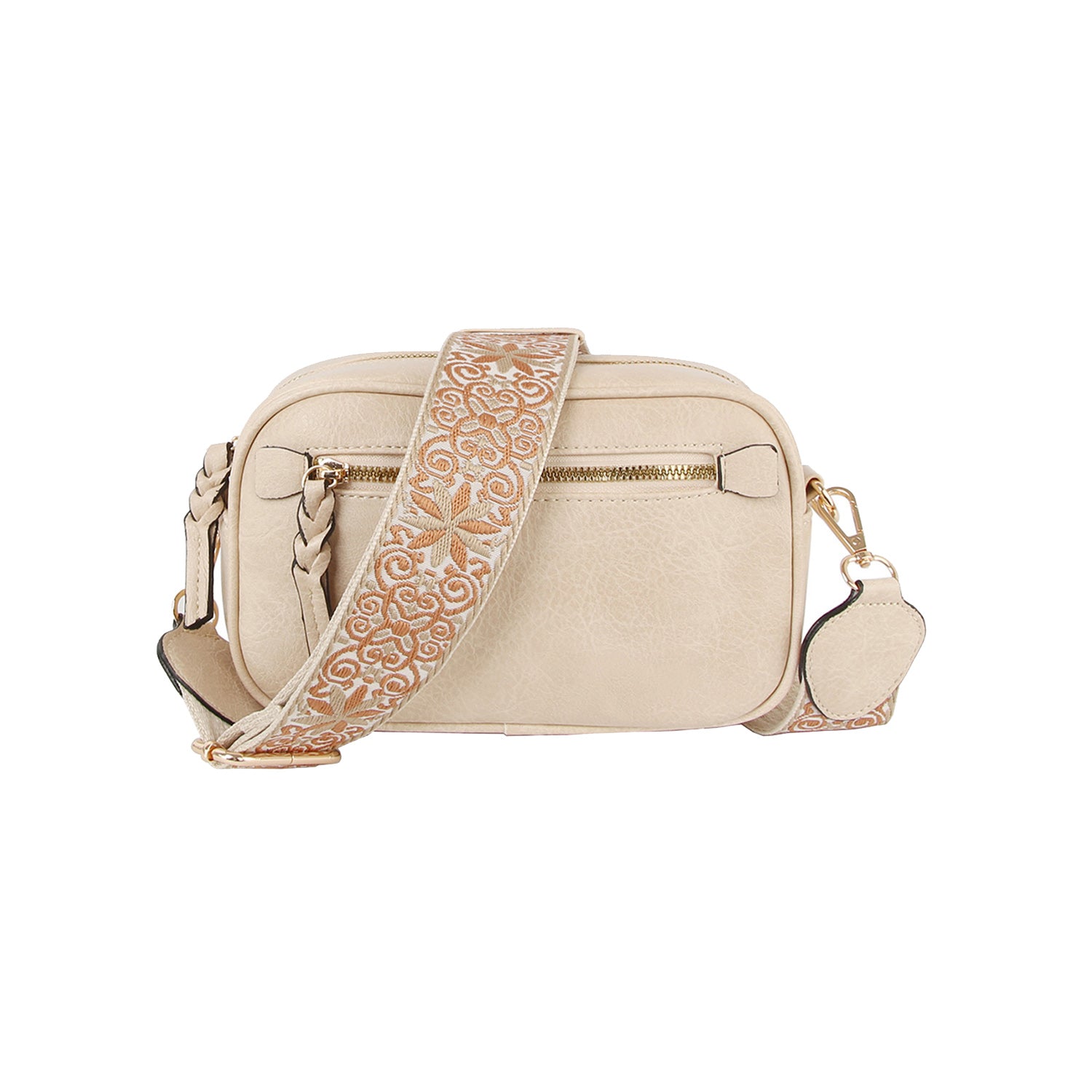 The Guitar Strap Crossbody Sling is a small beige faux leather bag with a front zipper pocket, gold-toned hardware, and a wide adjustable strap embroidered with gold and white floral patterns.
