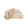 The Guitar Strap Crossbody Sling is a small beige faux leather bag with a front zipper pocket, gold-toned hardware, and a wide adjustable strap embroidered with gold and white floral patterns.
