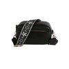 The Guitar Strap Crossbody Sling is a black faux leather bag with gold-toned hardware, a front zip pocket, and a wide, adjustable strap with a white floral and leaf pattern on black.