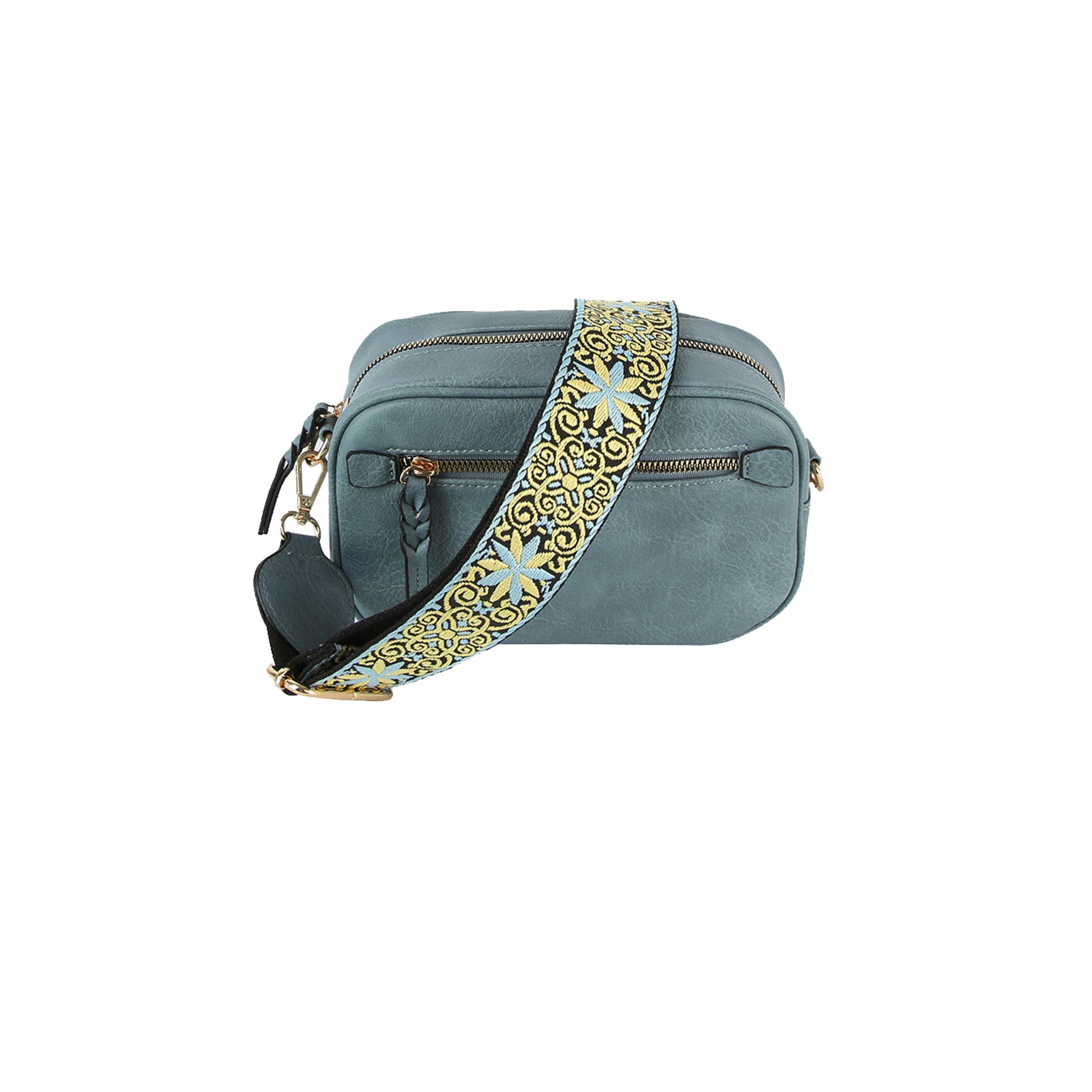 The Guitar Strap Crossbody Sling features blue faux leather, gold-toned hardware, two zippered compartments, and a wide decorative strap with a yellow, gold, blue, and black floral pattern.