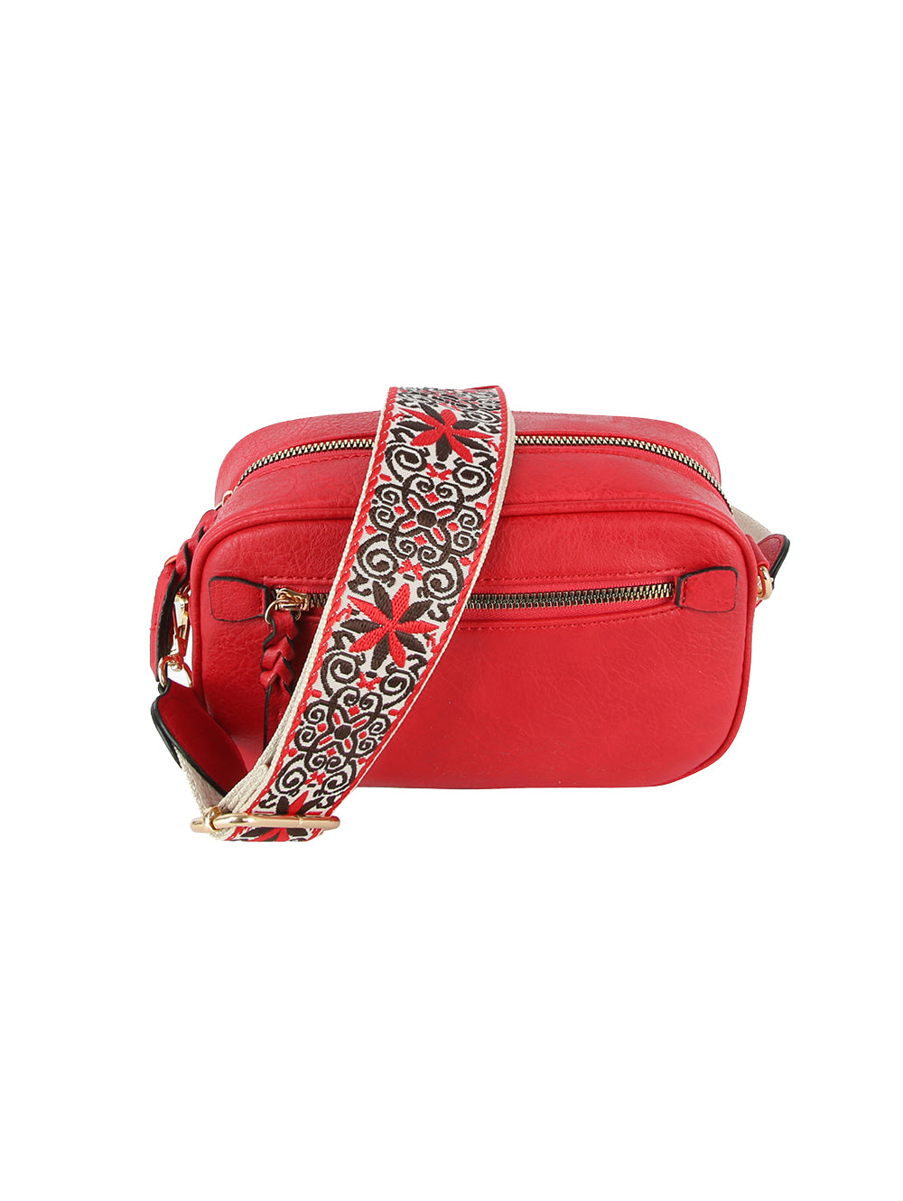 The Guitar Strap Crossbody Sling is a small rectangular red faux leather bag with gold zippers and hardware, featuring a wide adjustable strap decorated with a black, white, and red floral pattern.