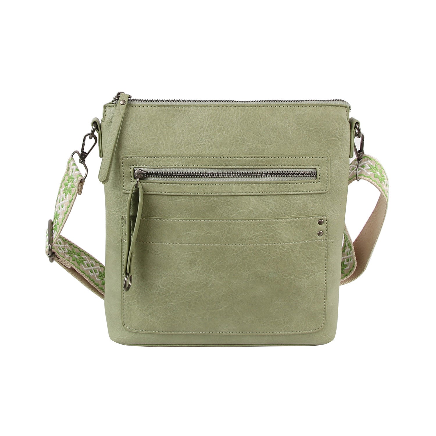 The Daily Zip Pocket Guitar Strap Crossbody Bag features sage green textured faux leather, a front zipper pocket, extra front slip pockets, silver-tone hardware, and a wide crossbody strap in light green and beige.