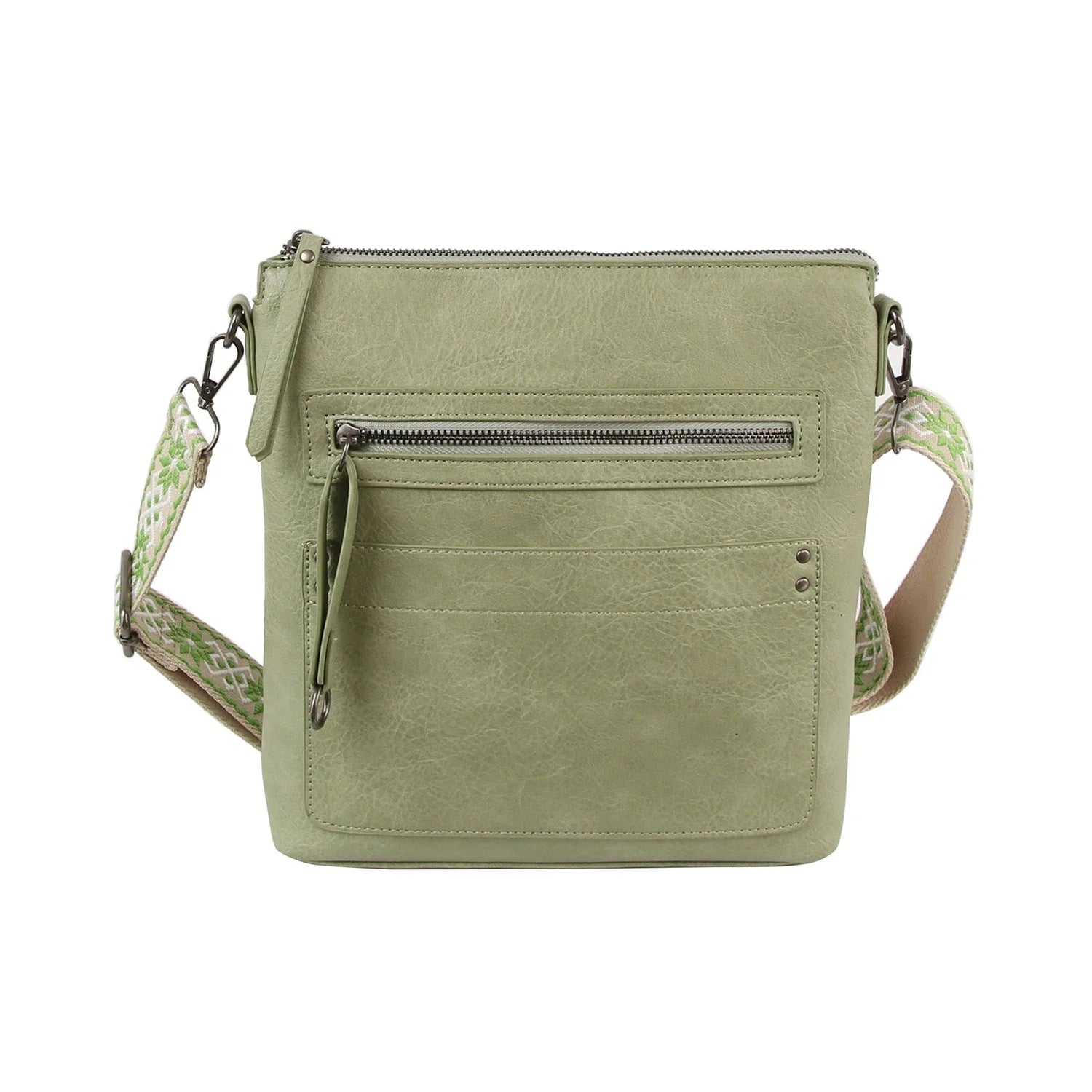 The Guitar Strap Everyday Crossbody Sling is a light green faux leather bag with zippered pockets, extra front pockets, and a wide green-and-white patterned adjustable strap, featuring metal hardware and a minimalist style.