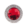 The Gem and Rhinestone Purse Hanger features a large faceted central gem, encircled by small clear rhinestones, all set in a round silver metal frame.
