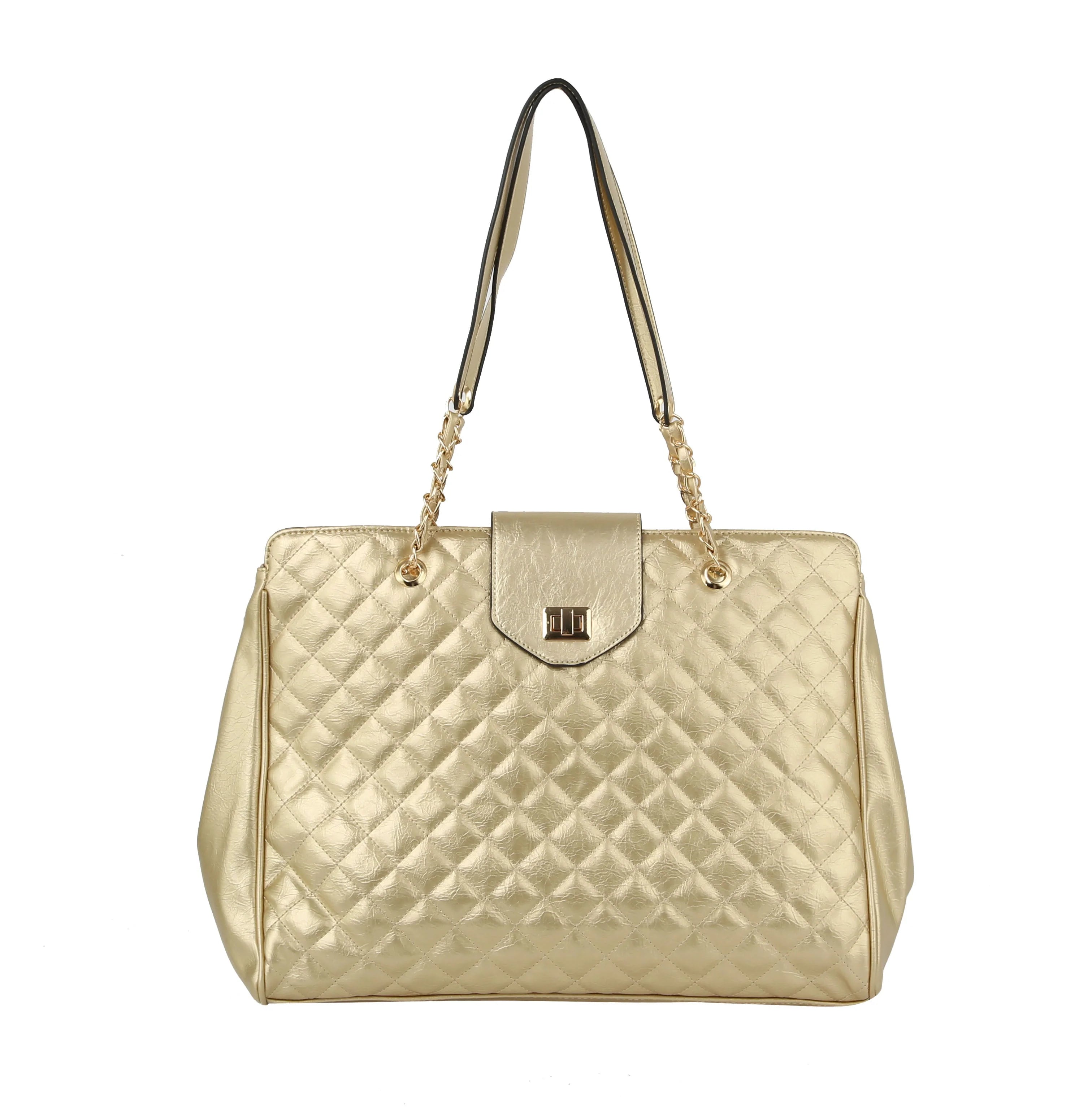 The Oversized Quilted Tote Travel Bag features gold quilted faux leather, chain and leather shoulder straps, a central gold clasp on the flap closure—ideal for stylish travel.