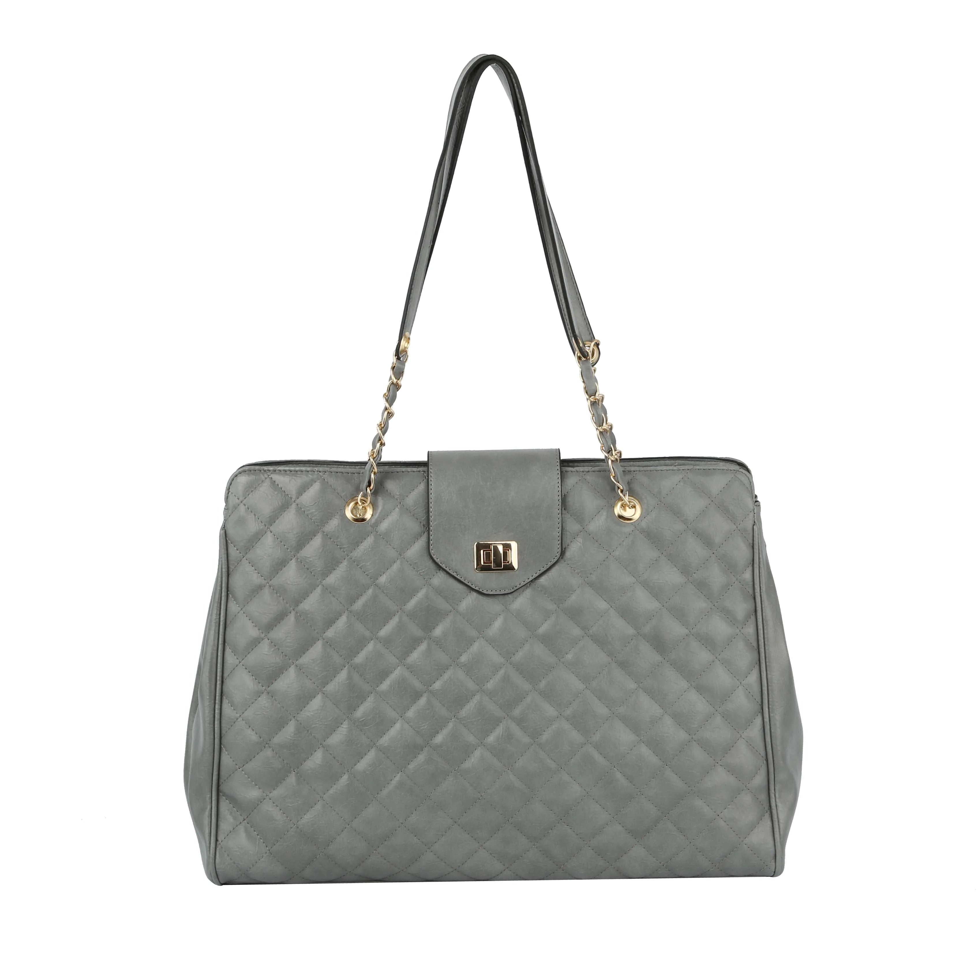The Oversized Quilted Tote Travel Bag is a gray faux leather handbag with gold chain and leather handles, a rectangular clasp on the front flap, structured shape, and an elegant minimalist design.