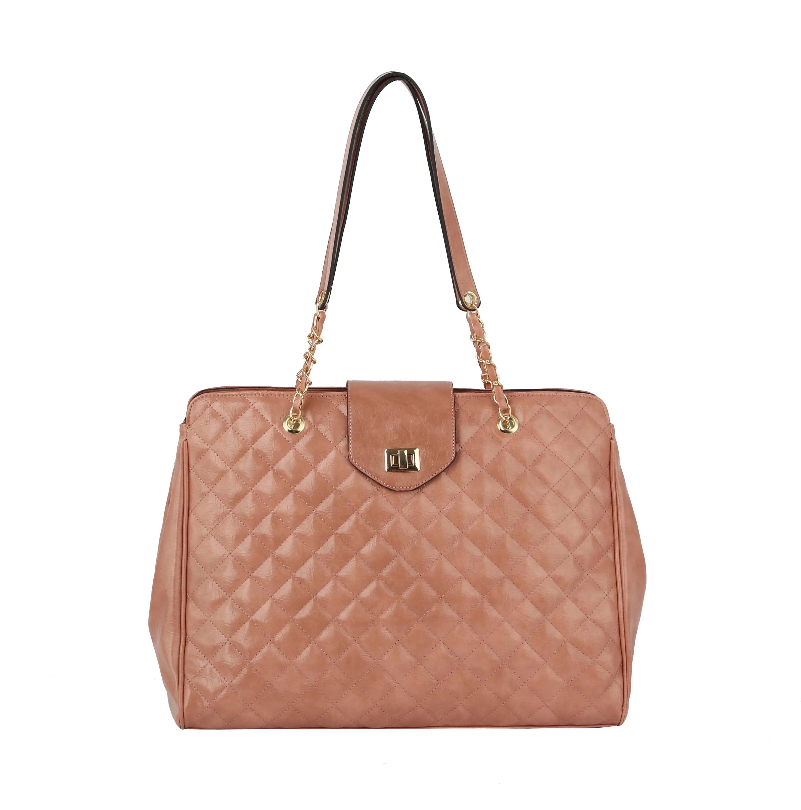The Oversized Quilted Tote Travel Bag features a pink quilted design, gold chain and leather handles, a front flap with gold hardware, structured rectangular shape, and a luggage sleeve for effortless travel.