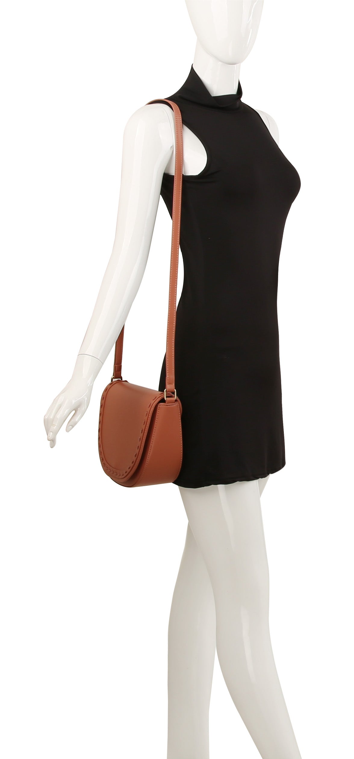 A mannequin in a sleeveless black dress displays the Stitch Accented Top Flap Shoulder Bag, a brown faux leather shoulder bag with gold-tone hardware and flap closure, against a plain white background.